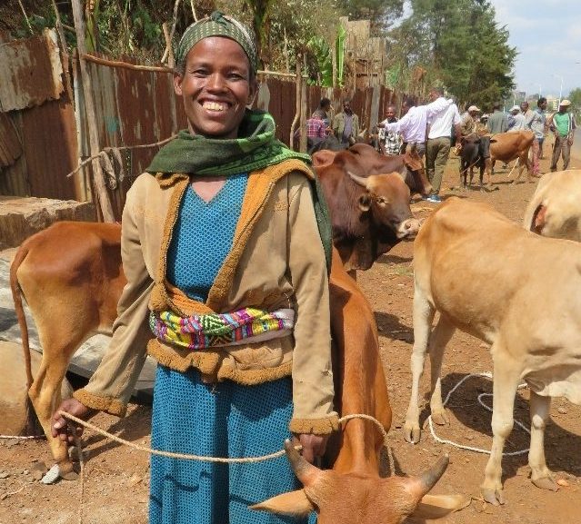 smiling woman and her new cow